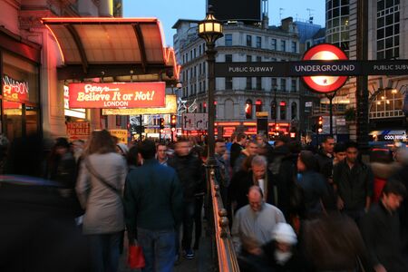 London, UK - November 13, 2010: Tourists in Piccadilly Circus, famous tourist attraction, road junction, built in 1819, meeting place, tourist attraction, in West End, inks to Shaftesbury Avenue, Regent Street, Haymarket, Leicester Square and Glasshouse Sのeditorial素材
