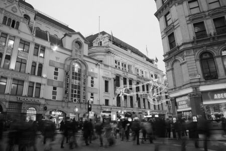 London, UK - November 13, 2010: Tourists in Piccadilly Circus, famous tourist attraction, road junction, built in 1819, meeting place, tourist attraction, in West End, inks to Shaftesbury Avenue, Regent Street, Haymarket, Leicester Square and Glasshouse Sのeditorial素材