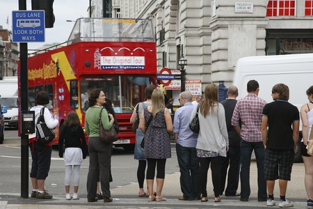London, UK - August 9, 2010: Tourists in Piccadilly Circus, famous tourist attraction, road junction, built in 1819, meeting place, tourist attraction, in West End, inks to Shaftesbury Avenue, Regent Street, Haymarket, Leicester Square and Glasshouse Streのeditorial素材