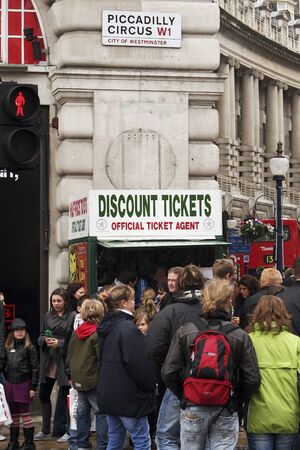 London, UK - April 1, 2010: Tourists in Piccadilly Circus, famous tourist attraction, road junction, built in 1819, meeting place, tourist attraction, in West End, inks to Shaftesbury Avenue, Regent Street, Haymarket, Leicester Square and Glasshouse Streeのeditorial素材