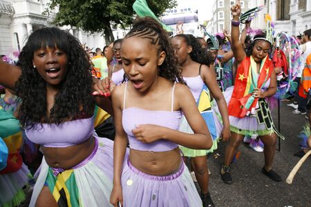 London, UK - August 27, 2012: Performers take part in the second day of Notting Hill Carnival, largest in Europe. Carnival takes place over two days in every August. のeditorial素材