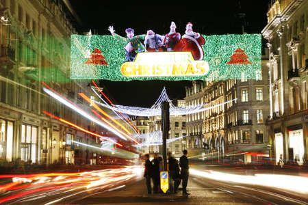 London, UK - November 17, 2011: Christmas Lights Display on Regend Street in London. The modern colourful Christmas lights attract and encourage people to the street.のeditorial素材