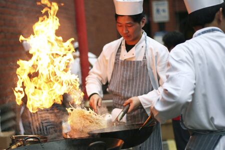 London, UK - February 18, 2007: Chinese chefs working at the Chinese New Year celebrations in London's Chinatown. Visitors Line the Streets during the Chinese New Year Celebrations. Chinese New Year Celebrations is one of the most favorite annual London Eのeditorial素材
