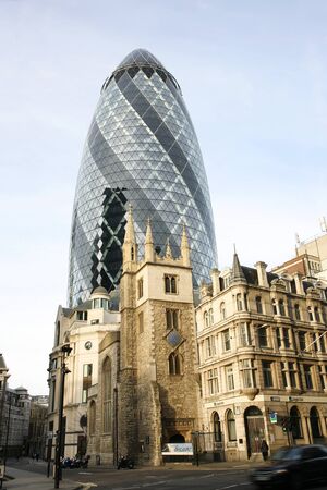 London , UK - March 25, 2012: Outside view of 30 St Mary Axe, also called Gherkin, a skyscraper in the City of London, 180 metres height, 41 floors, completed in 2003, seen from pedestrian walk path. 
のeditorial素材