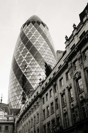 London , UK - March 25, 2012: Outside view of 30 St Mary Axe, also called Gherkin, a skyscraper in the City of London, 180 metres height, 41 floors, completed in 2003, seen from pedestrian walk path. 
のeditorial素材