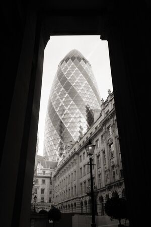 London , UK - March 25, 2012: Outside view of 30 St Mary Axe, also called Gherkin, a skyscraper in the City of London, 180 metres height, 41 floors, completed in 2003, seen from pedestrian walk path. 
のeditorial素材