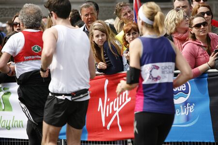 London, UK - April 21, 2013: Supporters watch and cheer thousands of marathon runners. The London Marathon is next to New York, Berlin, Chicago and Boston to the World Marathon Majors, the Champions League in the marathon
のeditorial素材