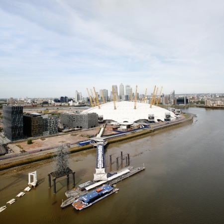 London , UK - May 26, 2013:  London Skyline, seen from the Emirates Air Line cable car, inclouding O2 Arena, Canary Wharf's skyscrapers, tour boat and pier, across the River Thames in London.
のeditorial素材
