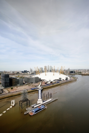 London , UK - May 26, 2013:  London Skyline, seen from the Emirates Air Line cable car, inclouding O2 Arena, Canary Wharf's skyscrapers, tour boat and pier, across the River Thames in London.
のeditorial素材