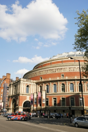 London, UK - May 26, 2013 : London Taxi, also called hackney carriage, black cab, Royal Albert Hall in the background, people and cars present on the street. Traditionally Taxi cabs are all black in London but now produced in various colors.
のeditorial素材