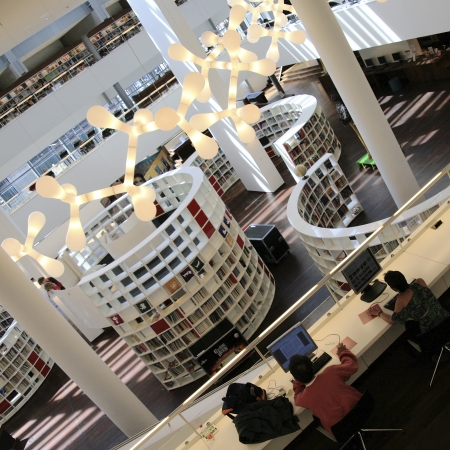 Amsterdam, Netherlands - June 21, 2010: Inside view of Amsterdam Central Library, library users present, the Centrale Bibliotheek, estabilished in 1919, largest public library in Europe, designed by Jo Coenen. This library has 1200 seats spread out over 1のeditorial素材