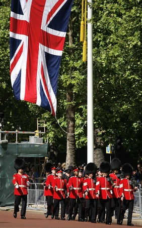 London, UK - June 15, 2013: Queen's Soldier at Queen's Birthday Parade, union jack present. Queen's Birthday Parade take place to Celebrate Queen's Official Birthday in every June in London. 
のeditorial素材