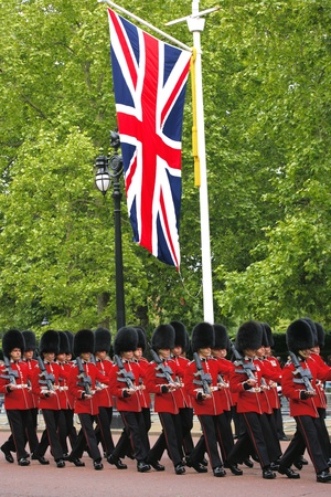 London, UK - June 15, 2013: Queen's Soldier at Queen's Birthday Parade, union jack present. Queen's Birthday Parade take place to Celebrate Queen's Official Birthday in every June in London. 
のeditorial素材
