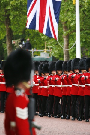 London, UK - June 15, 2013: Queen's Soldier at Queen's Birthday Parade, union jack present. Queen's Birthday Parade take place to Celebrate Queen's Official Birthday in every June in London. 
のeditorial素材
