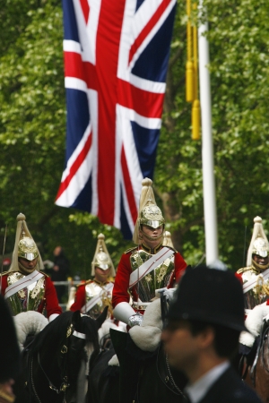 London, UK - June 15, 2013: Household Cavalry at Queen's Birthday Parade, Union Jack in the background. Queen's Birthday Parade take place to Celebrate Queen's Official Birthday in every June in London. 
のeditorial素材