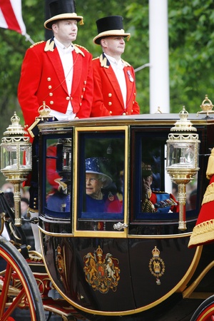 London, UK - June 15, 2013: Queen Elizabeth II seat on the Royal Coach at Queen's Birthday Parade, coach man present. Queen's Birthday Parade take place to Celebrate Queen's Official Birthday in every June in London. 
のeditorial素材
