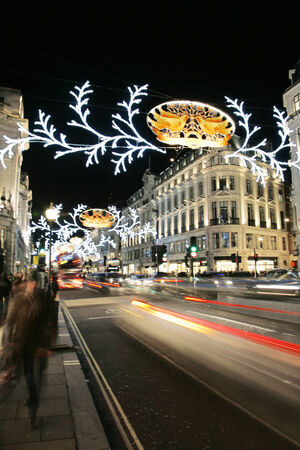 London, UK - November 21, 2013: Christmas Lights Display on Regent Street in London, people and bus present. The modern colourful Christmas lights attract and encourage people to the street. 
のeditorial素材