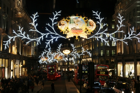 London, UK - November 21, 2013: Christmas Lights Display on Regent Street in London, people present. The modern colourful Christmas lights attract and encourage people to the street. 
のeditorial素材