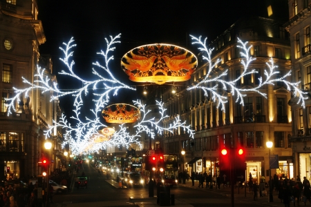 London, UK - November 21, 2013: Christmas Lights Display on Regent Street in London, people present. The modern colourful Christmas lights attract and encourage people to the street. 
のeditorial素材