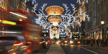 London, UK - December 4, 2013: Christmas Lights Display on Regent  Street, people prsent, in London. The modern colourful Christmas lights attract and encourage people to the street. 
のeditorial素材