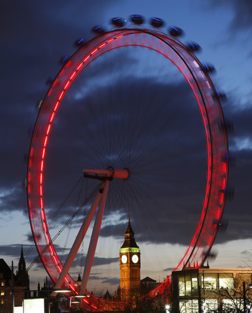 London, UK - Feb 16, 2014: View of The London Eye with Big Ben at Sunset.   London Eye is the famous tourist attraction at a height of 135 metres (443 ft) and the biggest Ferris wheel in Europe. 
のeditorial素材
