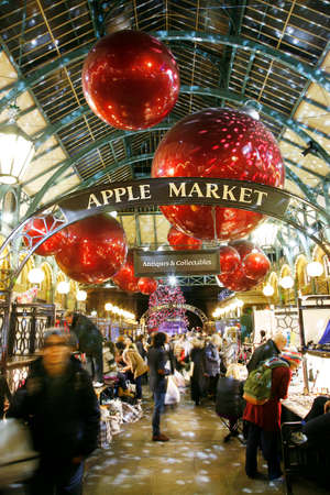 London, UK - December 9, 2013: Christmas Lights Display in Covent Garden Market, people prsent, in London. The modern colourful Christmas lights attract and encourage people to the market. 
のeditorial素材