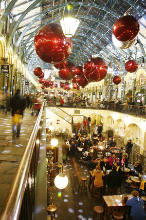 London, UK - December 9, 2013: Christmas Lights Display in Covent Garden Market, people prsent, in London. The modern colourful Christmas lights attract and encourage people to the market. 
のeditorial素材