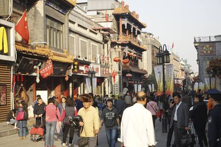 London, UK - Oct 17, 2014:  Street view of Dazhalan Market, crowd present. This is the famous business street outside Qianmen, one of the largest traditional market in Beijing.のeditorial素材