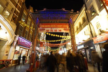 London, UK - Feb 21, 2015:  Night view of London ChinaTown, Chinese New Year Eve, people present, established in 1880 th of Chinese sailors and traders, located in Soho area. a major touristic attraction.のeditorial素材