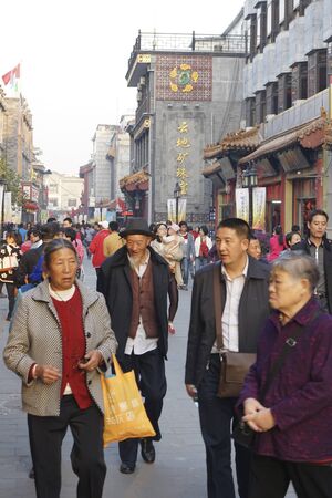 London, UK - Oct 17, 2014:  Street view of Dazhalan Market, crowd present. This is the famous business street outside Qianmen, one of the largest traditional market in Beijing.のeditorial素材