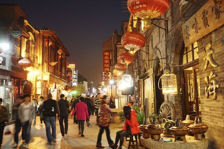 London, UK - Oct 17, 2014:  Street view of Dazhalan Market, crowd present. This is the famous business street outside Qianmen, one of the largest traditional market in Beijing.のeditorial素材
