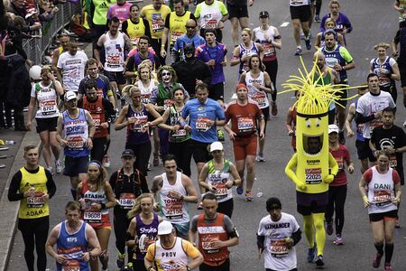 London, UK - April 26, 2015: Participant wearing funny costume in the crowds of runners of London Marathon. The London Marathon is next to New York, Berlin, Chicago and Boston to the World Marathon Majors, the Champions League in the marathon.のeditorial素材