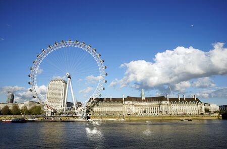 LONDON - APRIL 29 : View of The London Eye on April 29, 2015 in London, UK. A famous tourist attraction at a height of 135 metres (443 ft) and the biggest Ferris wheel in Europe.のeditorial素材