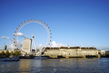 LONDON - APRIL 29 : View of The London Eye on April 29, 2015 in London, UK. A famous tourist attraction at a height of 135 metres (443 ft) and the biggest Ferris wheel in Europe.のeditorial素材