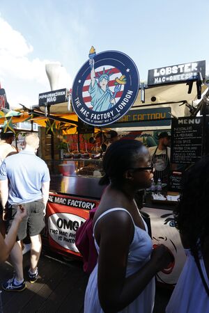 London, UK - August 22, 2015: Street Foods in Camden Market, people present, famous tourist attractions in Camden Town, also called Camden Lock. The Market attracting about 100,000 visitors each weekend.のeditorial素材