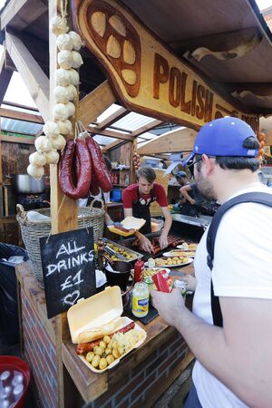 London, UK - August 22, 2015: Street Foods in Camden Market, people present, famous tourist attractions in Camden Town, also called Camden Lock. The Market attracting about 100,000 visitors each weekend.のeditorial素材