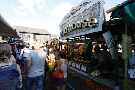 London, UK - August 22, 2015: Street Foods in Camden Market, people present, famous tourist attractions in Camden Town, also called Camden Lock. The Market attracting about 100,000 visitors each weekend.のeditorial素材