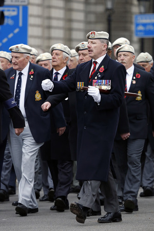 London, UK - November 8, 2015: People take part in Remembrance Day, Poppy Day or Armistice Day, nearst Sunday of 11 every Nov, observed by Commonwealth of Nations, to remember armed forces who have died since First World War.のeditorial素材