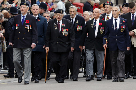 London, UK - November 8, 2015: People take part in Remembrance Day, Poppy Day or Armistice Day, nearst Sunday of 11 every Nov, observed by Commonwealth of Nations, to remember armed forces who have died since First World War.のeditorial素材