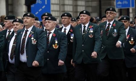 London, UK - November 8, 2015: People take part in Remembrance Day, Poppy Day or Armistice Day, nearst Sunday of 11 every Nov, observed by Commonwealth of Nations, to remember armed forces who have died since First World War.のeditorial素材
