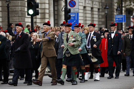 London, UK - November 8, 2015: People take part in Remembrance Day, Poppy Day or Armistice Day, nearst Sunday of 11 every Nov, observed by Commonwealth of Nations, to remember armed forces who have died since First World War.のeditorial素材