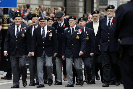 London, UK - November 8, 2015: People take part in Remembrance Day, Poppy Day or Armistice Day, nearst Sunday of 11 every Nov, observed by Commonwealth of Nations, to remember armed forces who have died since First World War.のeditorial素材