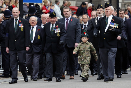 London, UK - November 8, 2015: People take part in Remembrance Day, Poppy Day or Armistice Day, nearst Sunday of 11 every Nov, observed by Commonwealth of Nations, to remember armed forces who have died since First World War.のeditorial素材