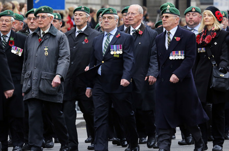 London, UK - November 8, 2015: People take part in Remembrance Day, Poppy Day or Armistice Day, nearst Sunday of 11 every Nov, observed by Commonwealth of Nations, to remember armed forces who have died since First World War.のeditorial素材