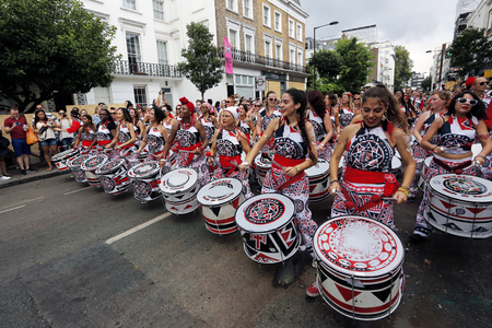 London , UK - Aug 29, 2016: Performers take part in the second day of Notting Hill Carnival, largest in Europe. Carnival takes place over two days in every August.のeditorial素材
