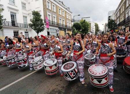 London , UK - Aug 29, 2016: Performers take part in the second day of Notting Hill Carnival, largest in Europe. Carnival takes place over two days in every August.のeditorial素材
