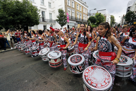 London , UK - Aug 29, 2016: Performers take part in the second day of Notting Hill Carnival, largest in Europe. Carnival takes place over two days in every August.のeditorial素材