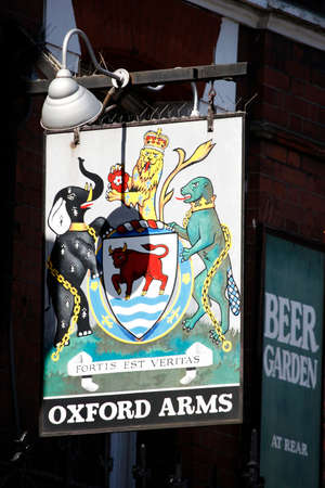 London, UK - April 20, 2013: English pub sign, Public house, known as pub, is focal point of community. Pub business, now about 53,500 pubs in UK, has been declining every year.のeditorial素材