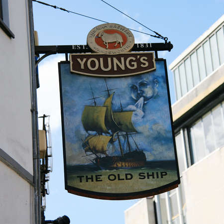 London, UK - July 15, 2010: English pub sign, Public house, known as pub, is focal point of community. Pub business, now about 53,500 pubs in UK, has been declining every year.のeditorial素材