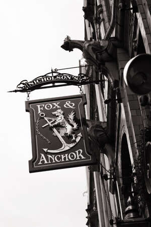 London, UK - April 09, 2006: English pub sign, Public house, known as pub, is focal point of community. Pub business, now about 53,500 pubs in UK, has been declining every year.のeditorial素材